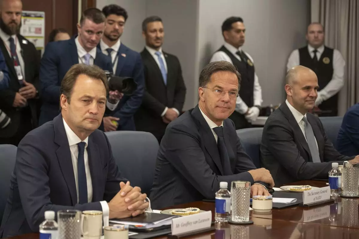 NATO Secretary General Mark Rutte, center, meets with Defense Secretary Pete Hegseth, at the Pentagon, Thursday, April 24, 2025 in Washington. (AP Photo/Kevin Wolf)