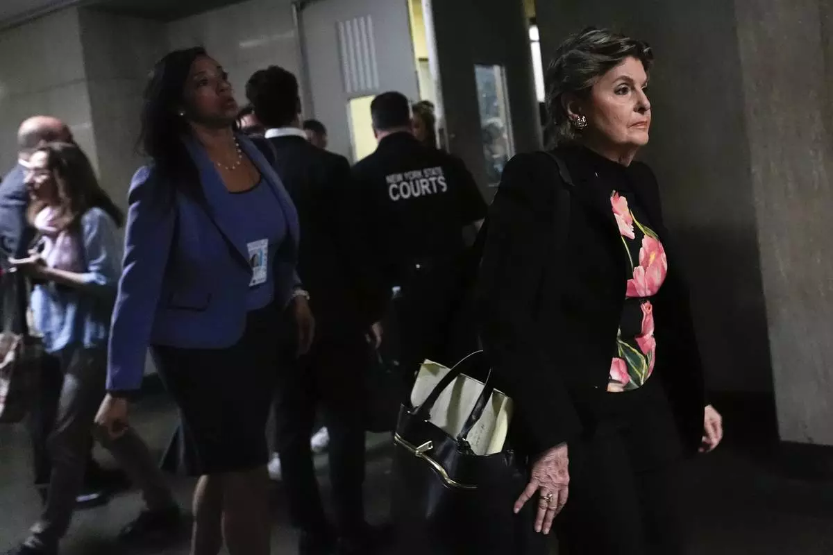 Attorney Gloria Allred leaves court for a break during Harvey Weinstein's retrial at Manhattan criminal court, Wednesday, April 23, 2025, in New York. (AP Photo/Julia Demaree Nikhinson)