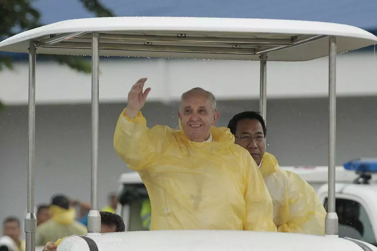 FILE - Pope Francis waves to the faithful on his arrival in Tacloban, Philippines, Jan. 17, 2015. (AP Photo/Wally Santana, File)