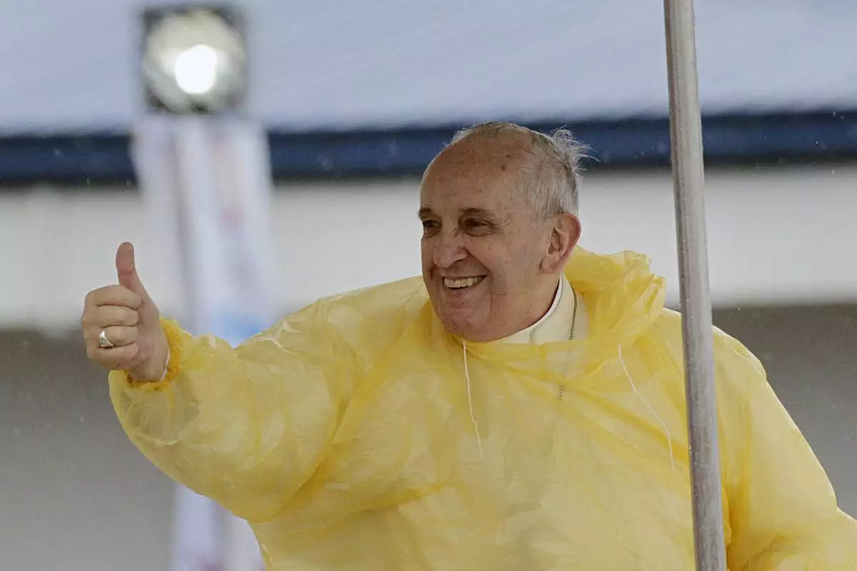 FILE - Pope Francis gives a thumbs up to the faithful as he arrives in Tacloban, Philippines, Jan. 17, 2015. (AP Photo/Wally Santana, File)