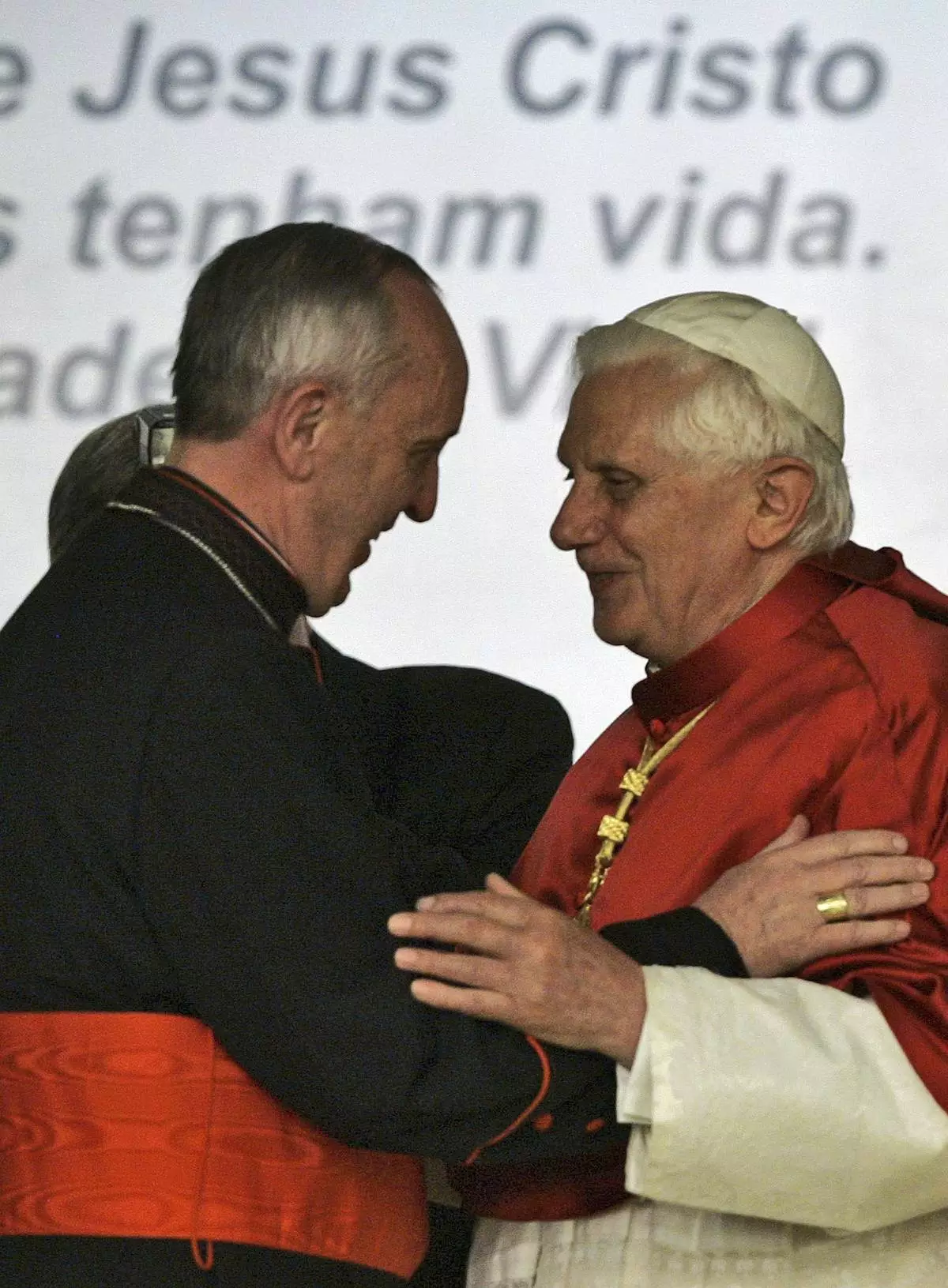FILE - Pope Benedict XVI, right, embraces Cardinal Jorge Bergoglio, Archbishop of Buenos Aires, during a conference of Latin American and Caribbean bishops in Aparecida, Brazil, May 13, 2007. (AP Photo/Ricardo Mazalan, File)