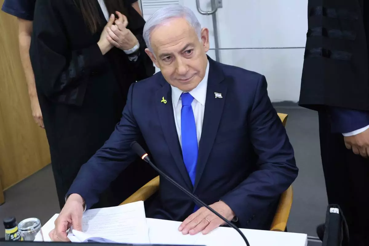 Israeli Prime Minister Benjamin Netanyahu attends his trial on corruption charges at the district court in Tel Aviv, Israel, Monday, April 21, 2025. (Moti Kimchi/Pool Photo via AP)