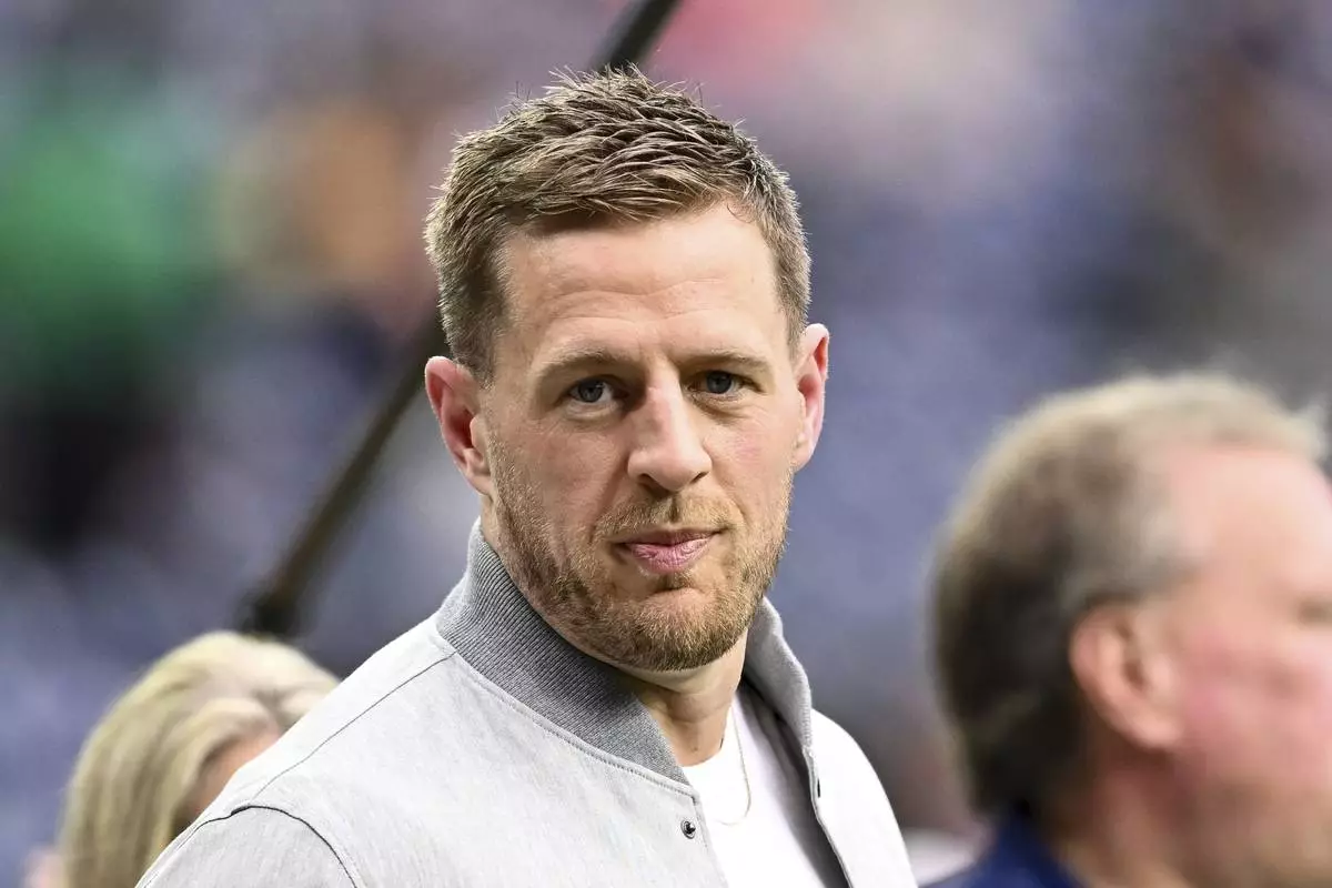 FILE - Former Houston Texans players J.J. Watt stands on the sidelines prior to an NFL football game between the Pittsburgh Steelers and the Houston Texans, Oct. 1, 2023 in Houston. (AP Photo/Maria Lysaker, file)