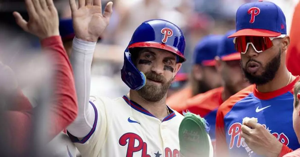 Phillies hold on after Miami's 6-run 9th to beat Marlins 11-10