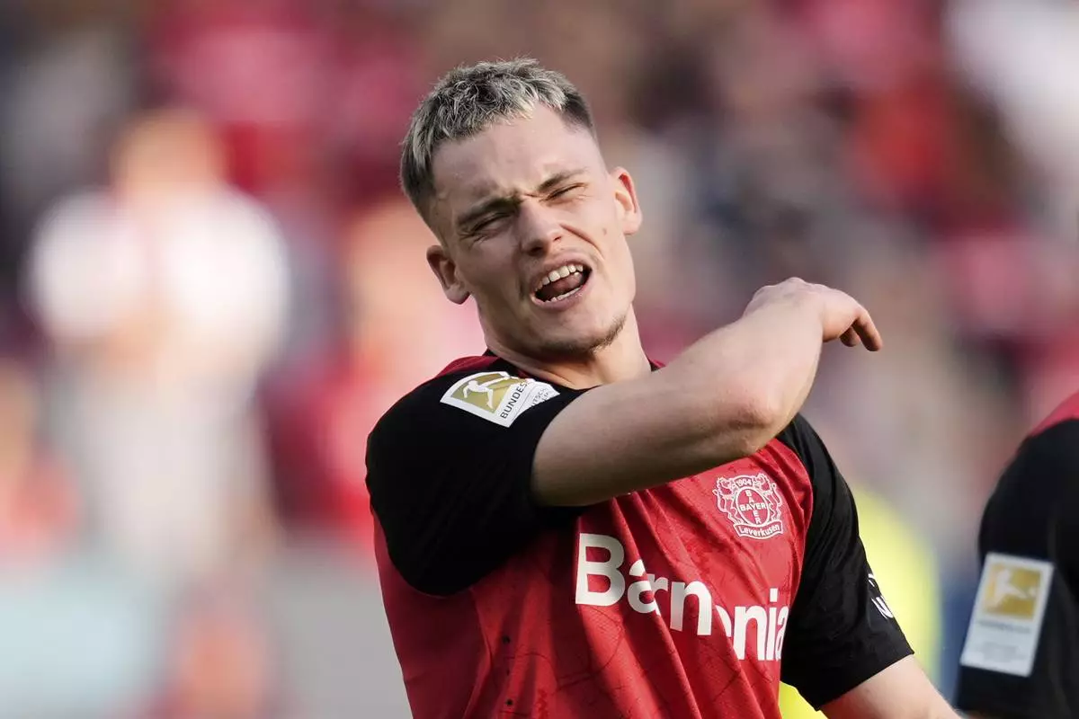 Leverkusen's Florian Wirtz reacts disappointed during the German Bundesliga soccer match between Bayer Leverkusen and Union Berlin at the BayArena in Leverkusen, Germany, Saturday, April 12, 2025. (AP Photo/Martin Meissner)