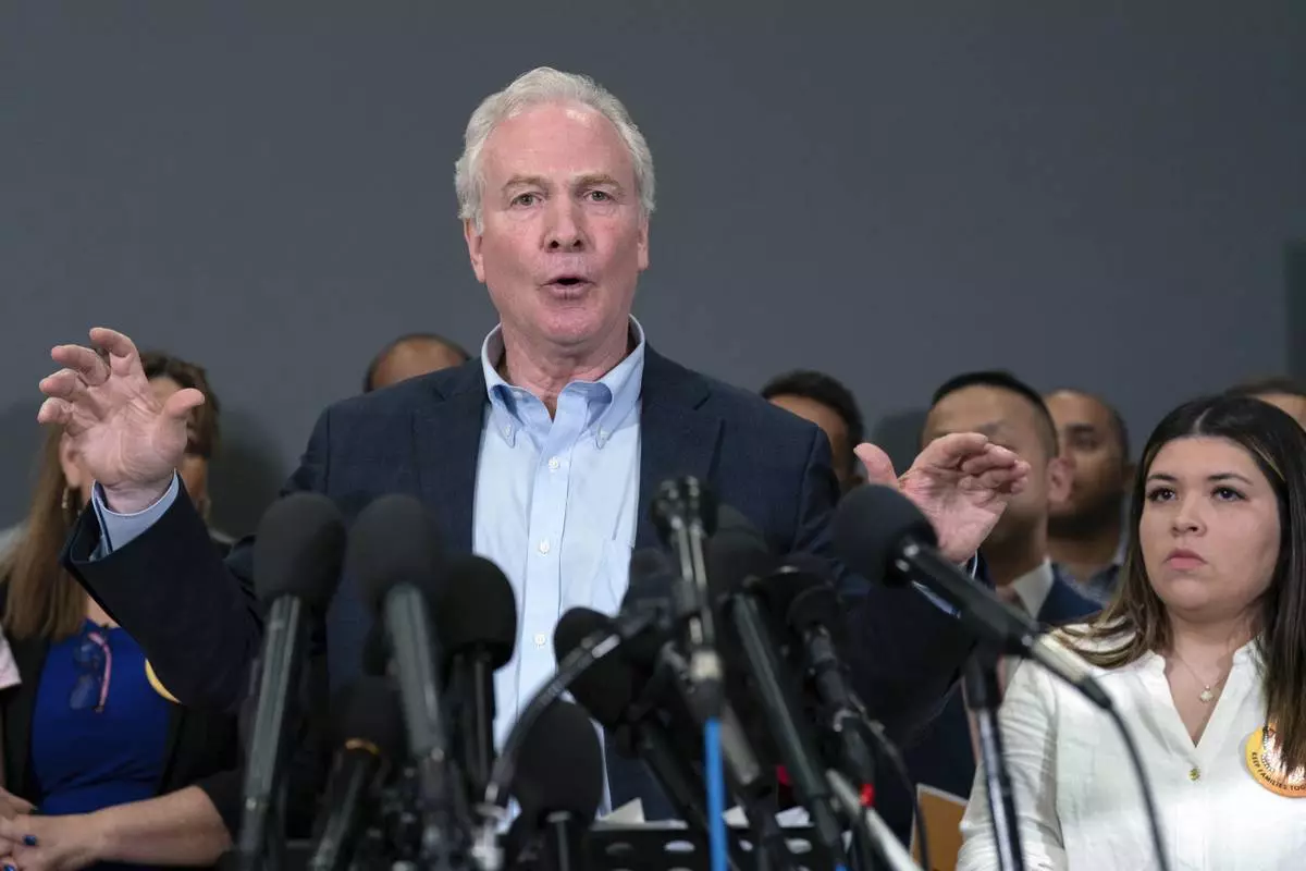 Sen. Chris Van Hollen, D-Md., speaks during a news conference upon his arrival from meeting with Kilmar Abrego Garcia in El Salvador, at Washington Dulles International Airport, in Chantilly, Va., Friday, April 18, 2025. (AP Photo/Jose Luis Magana)