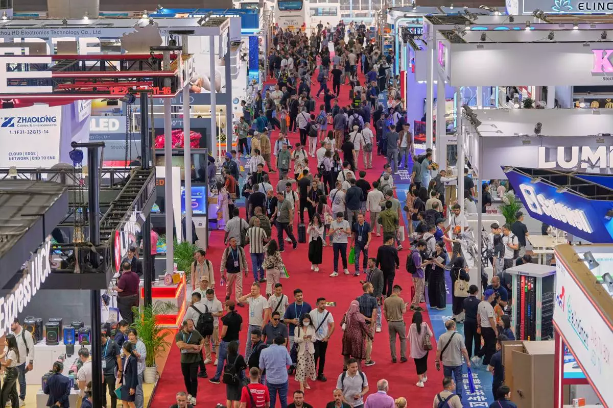 Visitors are seen at the 137th Canton Fair in Guangzhou, southern China's Guangdong province on Tuesday, April 15, 2025. (AP Photo/Ng Han Guan)