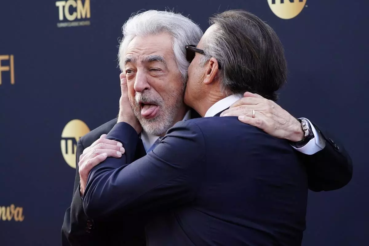 Joe Mantegna, left, and Andy García arrive at the 50th AFI Life Achievement Award tribute to Francis Ford Coppola on Saturday, April 26, 2025, at the Dolby Theatre in Los Angeles. (Photo by Jordan Strauss/Invision/AP)
