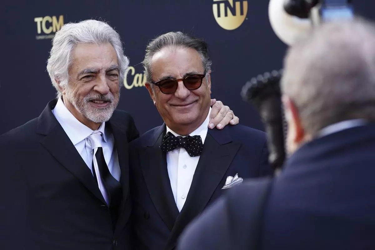 Joe Mantegna, left, and Andy García arrive at the 50th AFI Life Achievement Award tribute to Francis Ford Coppola on Saturday, April 26, 2025, at the Dolby Theatre in Los Angeles. (Photo by Jordan Strauss/Invision/AP)