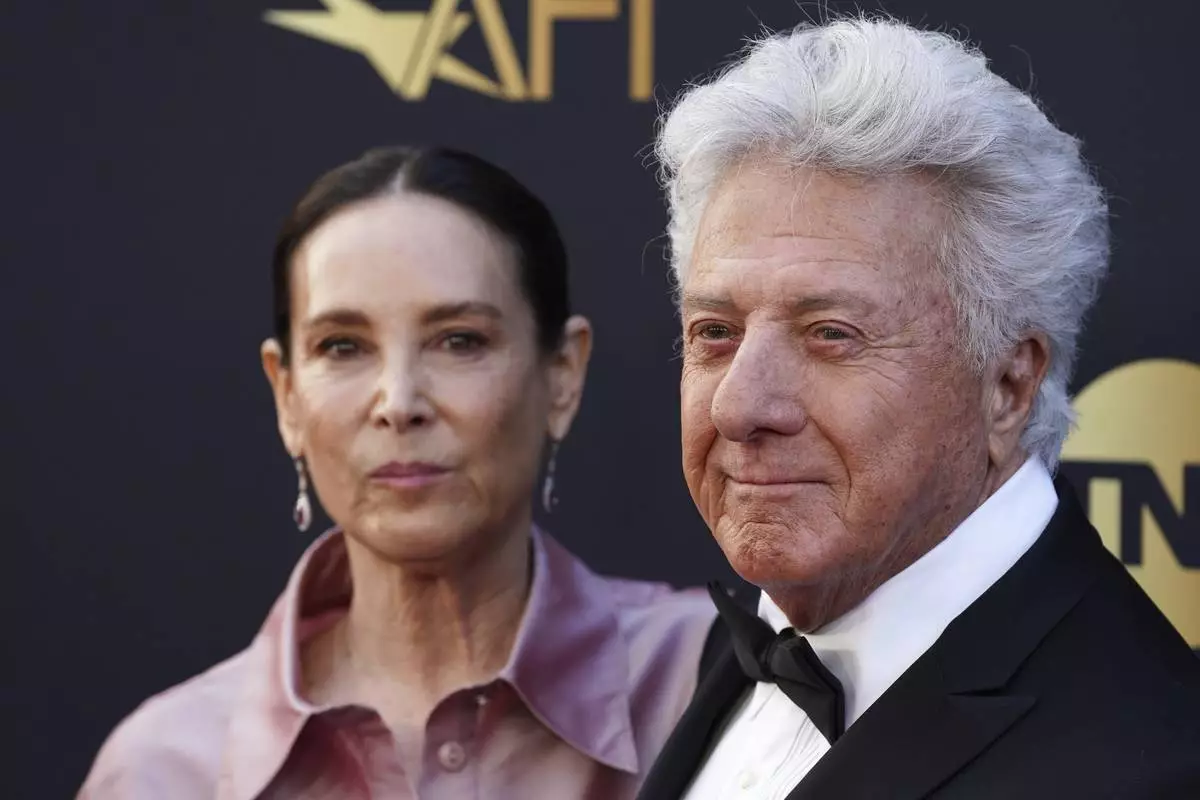 Lisa Hoffman, left, and Dustin Hoffman arrive at the 50th AFI Life Achievement Award tribute to Francis Ford Coppola on Saturday, April 26, 2025, at the Dolby Theatre in Los Angeles. (Photo by Jordan Strauss/Invision/AP)