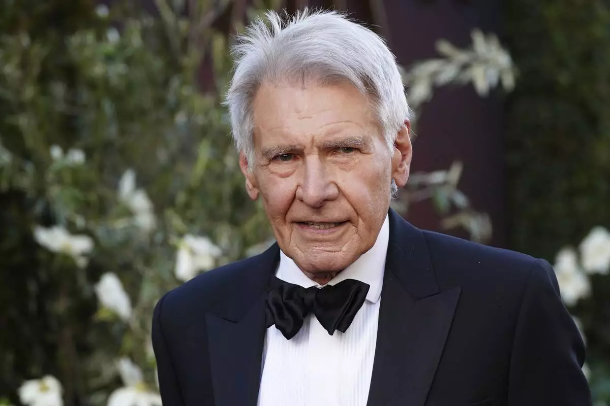 Harrison Ford arrives at the 50th AFI Life Achievement Award tribute to Francis Ford Coppola on Saturday, April 26, 2025, at the Dolby Theatre in Los Angeles. (Photo by Jordan Strauss/Invision/AP)