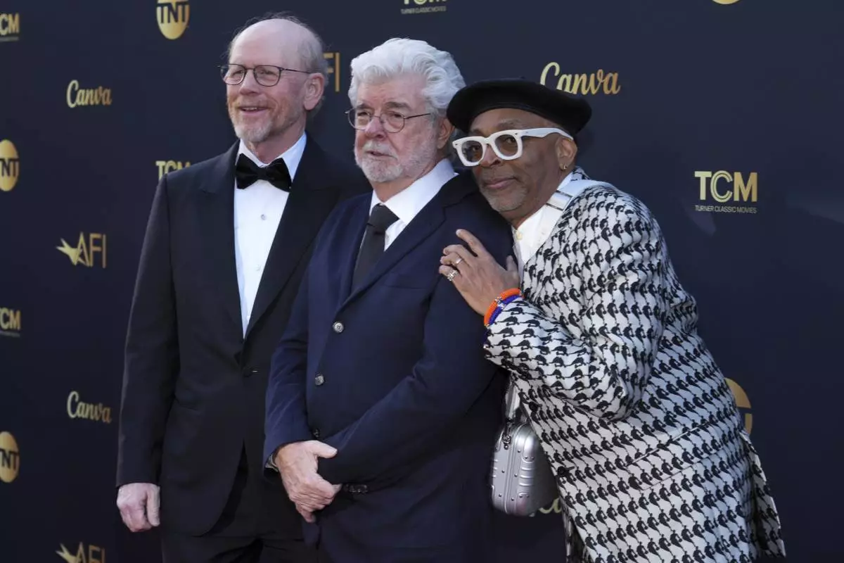 Ron Howard, from left, George Lucas and Spike Lee arrives at the 50th AFI Life Achievement Award tribute to Francis Ford Coppola on Saturday, April 26, 2025, at the Dolby Theatre in Los Angeles. (Photo by Jordan Strauss/Invision/AP)