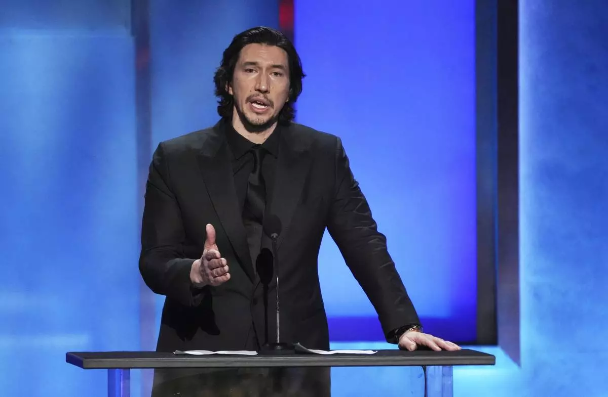Actor Adam Driver addresses the audience during the 50th AFI Life Achievement Award tribute to Francis Ford Coppola on Saturday, April 26, 2025, at the Dolby Theatre in Los Angeles. (AP Photo/Chris Pizzello)