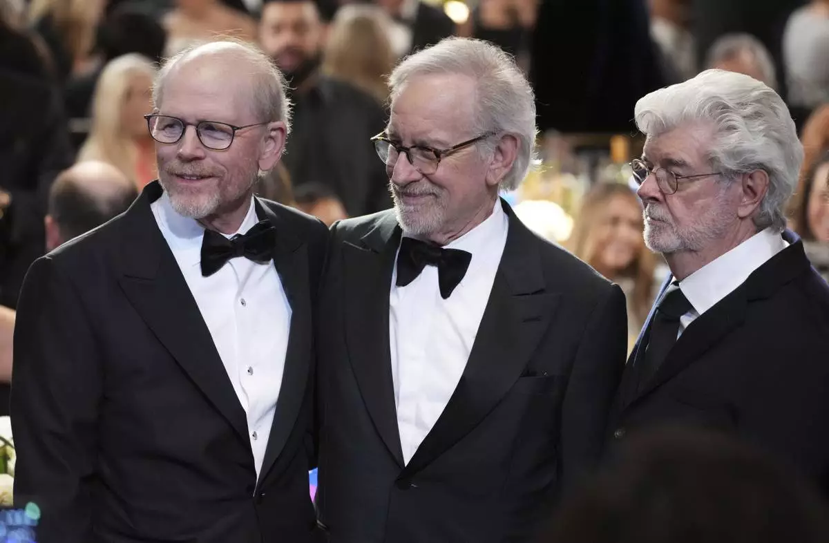 Filmmakers Ron Howard, left, Steven Spielberg, center, and George Lucas pose together during the 50th AFI Life Achievement Award tribute to Francis Ford Coppola on Saturday, April 26, 2025, at the Dolby Theatre in Los Angeles. (AP Photo/Chris Pizzello)