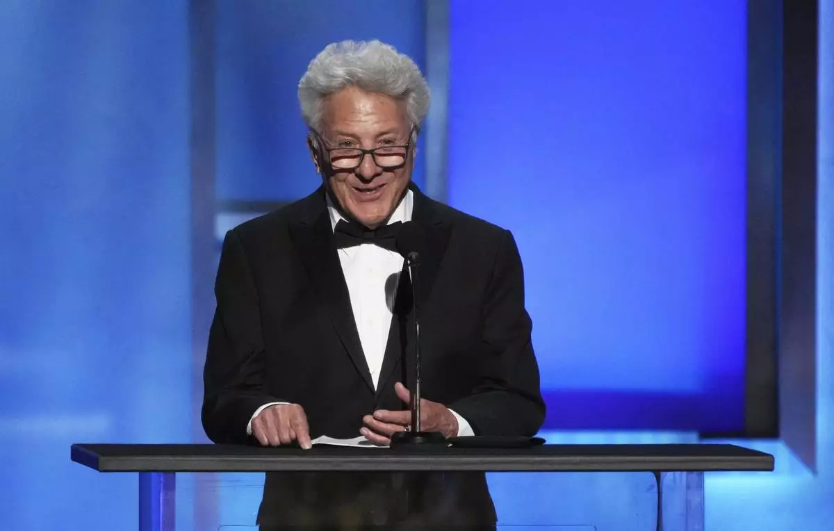 Actor Dustin Hoffman speaks from the podium during the 50th AFI Life Achievement Award tribute to Francis Ford Coppola on Saturday, April 26, 2025, at the Dolby Theatre in Los Angeles. (AP Photo/Chris Pizzello)