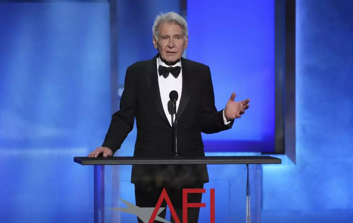 Actor Harrison Ford addresses the audience during the 50th AFI Life Achievement Award tribute to Francis Ford Coppola on Saturday, April 26, 2025, at the Dolby Theatre in Los Angeles. (AP Photo/Chris Pizzello)