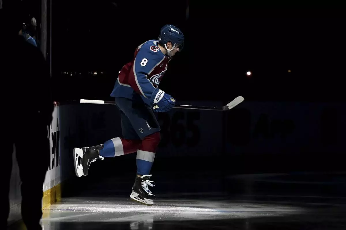 Colorado Avalanche defenseman Cale Makar (8) takes to the ice prior to the first period of an NHL hockey game against the Vegas Golden Knights Tuesday, April 8, 2025, in Denver. (AP Photo/Geneva Heffernan)
