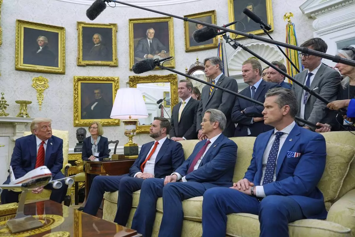 President Donald Trump speaks while meeting with Italy's Prime Minister Giorgia Meloni (unseen) in the Oval Office of the White House, Thursday, April 17, 2025, in Washington, as Vice President JD Vance, Treasury Secretary Scott Bessent and Defense Secretary Pete Hegseth listen. (AP Photo/Alex Brandon)