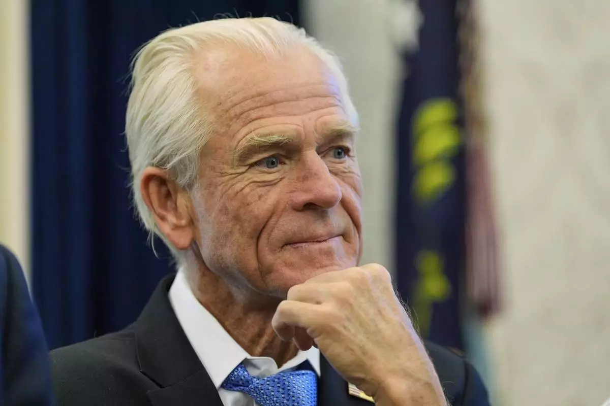 White House trade adviser Peter Navarro listens as President Donald Trump speaks as he signs executive orders in the Oval Office of the White House, Thursday, April 17, 2025, in Washington. (AP Photo/Alex Brandon)
