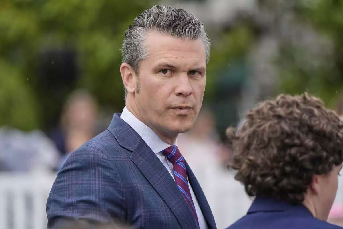 Defense Secretary Pete Hegseth arrives on the South Lawn of the White House before President Donald Trump and first lady Melania Trump participate in the White House Easter Egg Roll Monday, April 21, 2025, in Washington. (AP Photo/Alex Brandon)