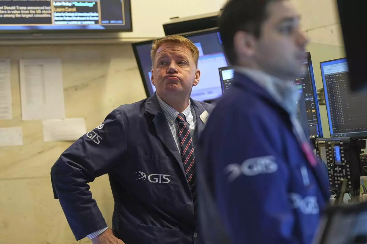 John Bowers works on the floor at the New York Stock Exchange in New York, Wednesday, April 9, 2025. (AP Photo/Seth Wenig)