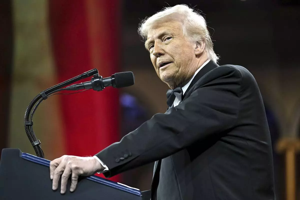 President Donald Trump speaks at the National Republican Congressional Committee (NRCC) dinner at the National Building Museum in Washington, Tuesday, April 8, 2025. (Pool via AP)