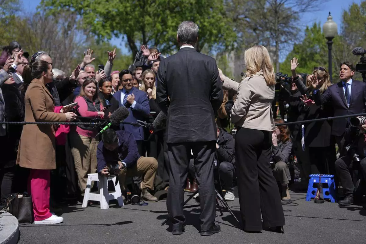 Treasury Secretary Scott Bessent speaks to reporters outside the West Wing of the White House, Wednesday, April 9, 2025, in Washington, with White House press secretary Karoline Leavitt. (AP Photo/Evan Vucci)