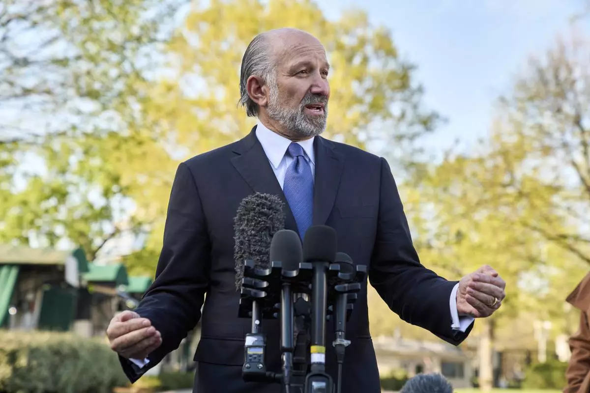 Commerce Secretary Howard Lutnick speaks to reporters outside the West Wing of the White House, Wednesday, April 9, 2025, in Washington. (AP Photo/Jacquelyn Martin)