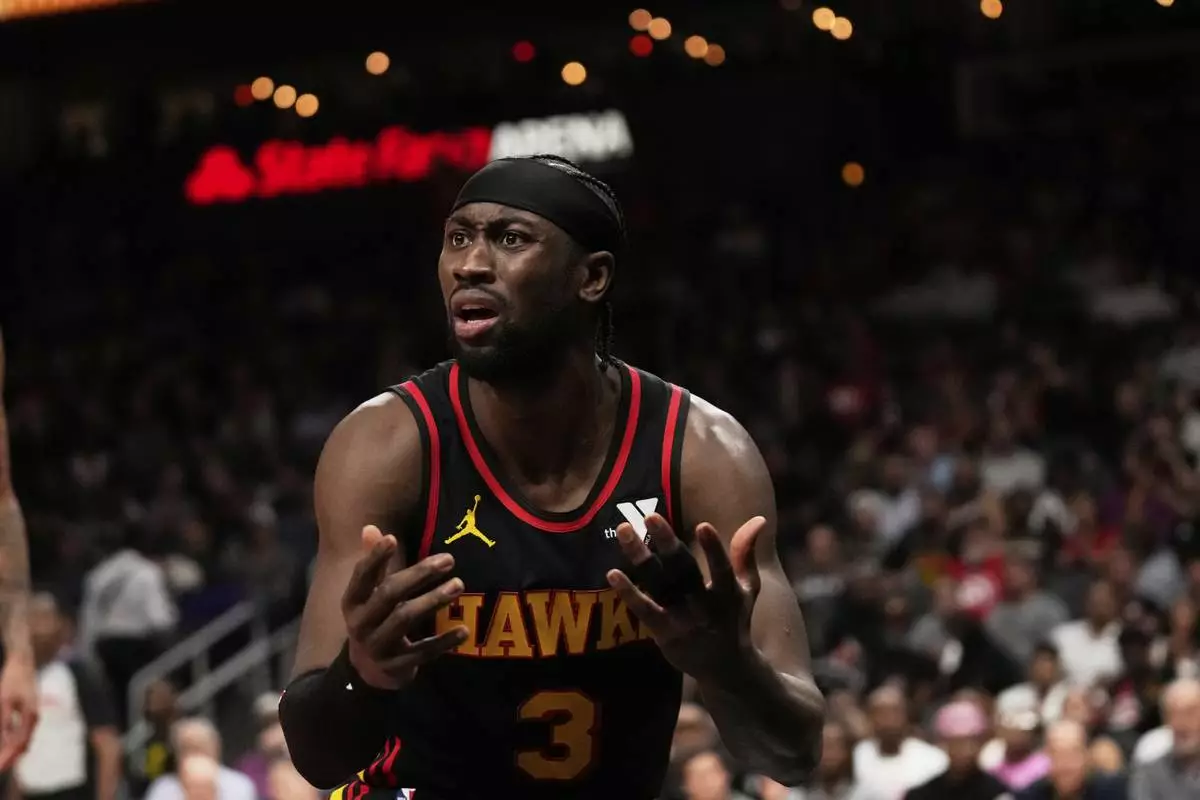 Atlanta Hawks guard Caris LeVert (3) reacts to a referee in the first half of an NBA play-in tournament basketball game against the Miami Heat, Friday, April 18, 2025, in Atlanta. (AP Photo/Brynn Anderson)