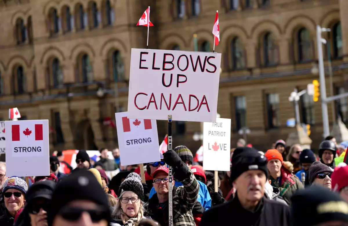 FILE - People rally in response to U.S. President Donald Trump's threats to Canadian sovereignty on Parliament Hill in Ottawa, March 9, 2025. (Justin Tang/The Canadian Press via AP, File)