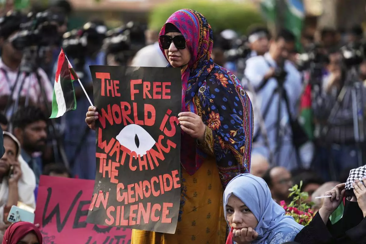 Supporters of the Pakistani religious group "Jamaat-e-Islami" take part in a rally against Israeli airstrikes and to show solidarity with Palestinian people living in Gaza, in Lahore, Pakistan Friday, April 11, 2025. (AP Photo/K.M. Chaudary)