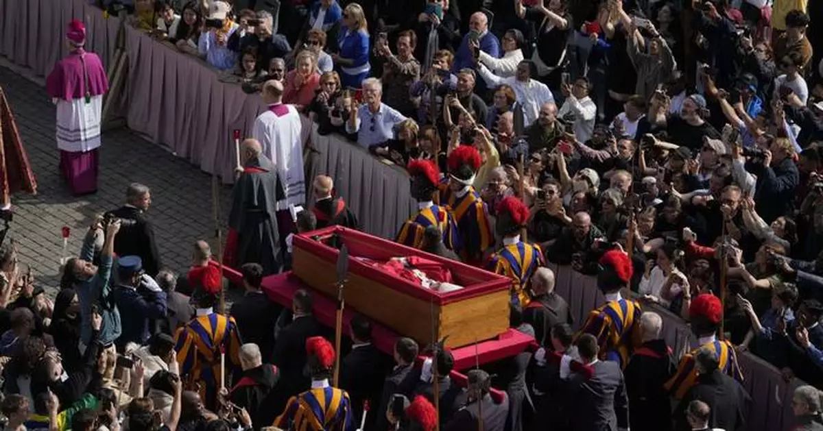 AP PHOTOS: Body of Pope Francis arrives at St. Peter’s Basilica following procession