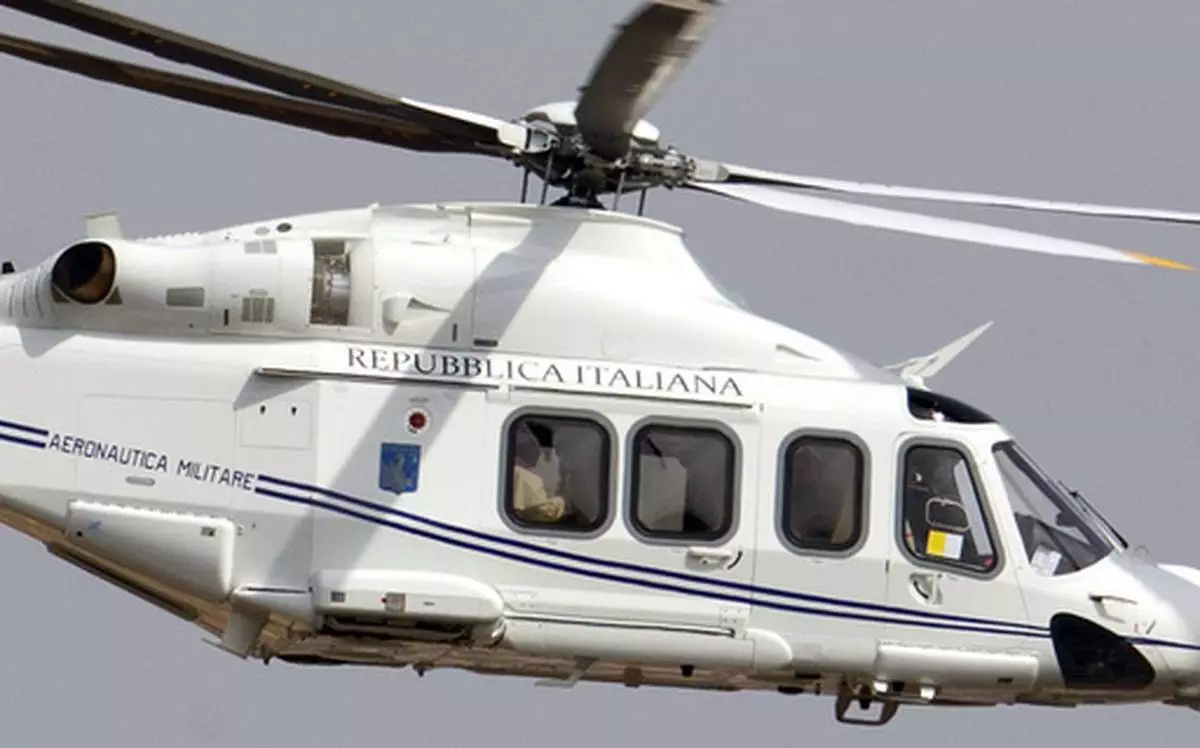 FILE - The helicopter carrying Pope Francis, sitting by the window at left, flies on its way to Castel Gandolfo, south of Rome, on March 23, 2013, to meet with Emeritus Pope Benedict XVI, where he has been living since resigning on Feb. 28, 2013. (AP Photo/Andrew Medichini, file)