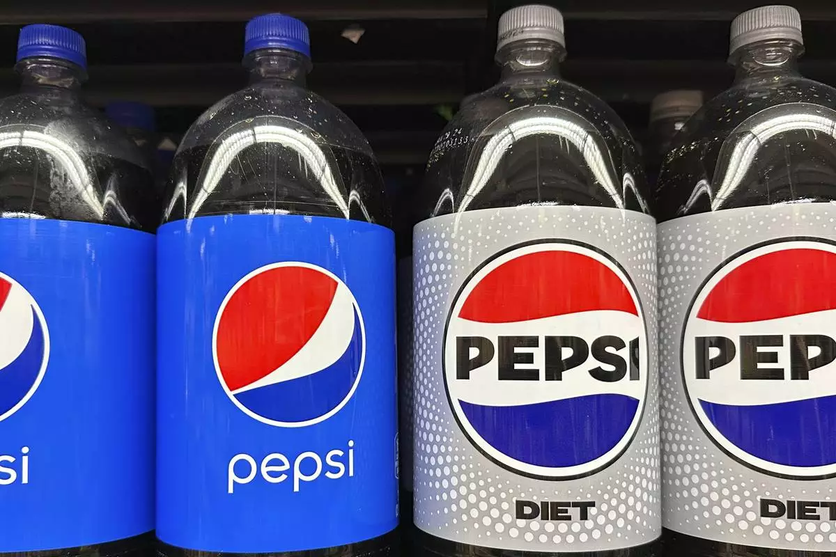 FILE - Plastic bottles of Pepsi are displayed at a grocery store in New York on Nov. 15, 2023. (AP Photo/Ted Shaffrey, File)