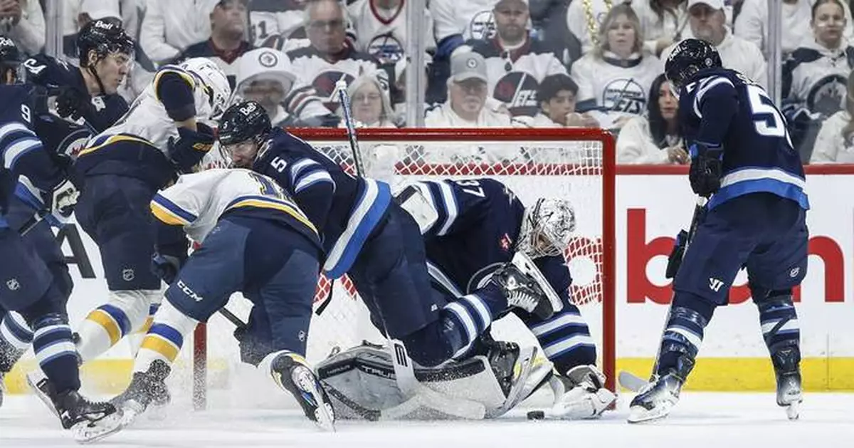 Connor’s late goal fuels Jets to 5-3 win over Blues in playoff opener