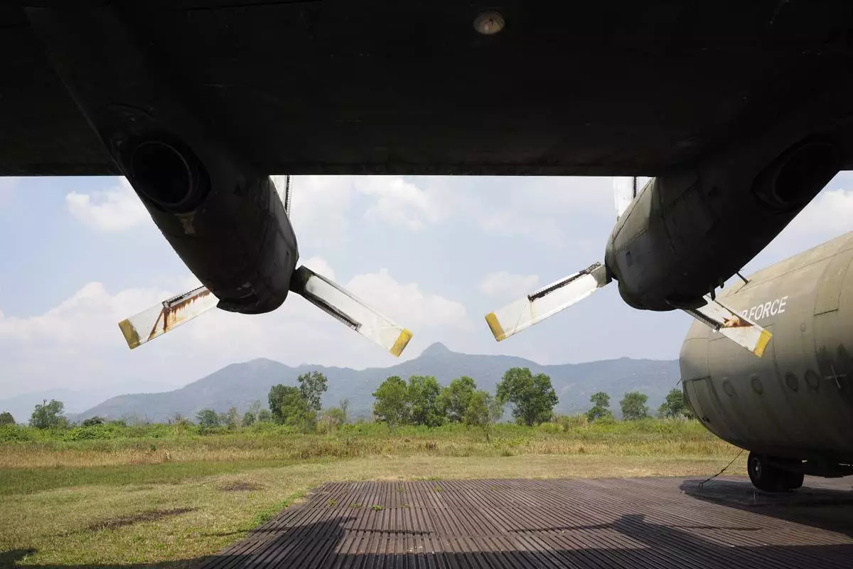 An American transport aircraft stands at the edge of the runway at the Khe Sanh Combat Base in Vietnam. Feb. 22, 2024. (AP Photo/David Rising)