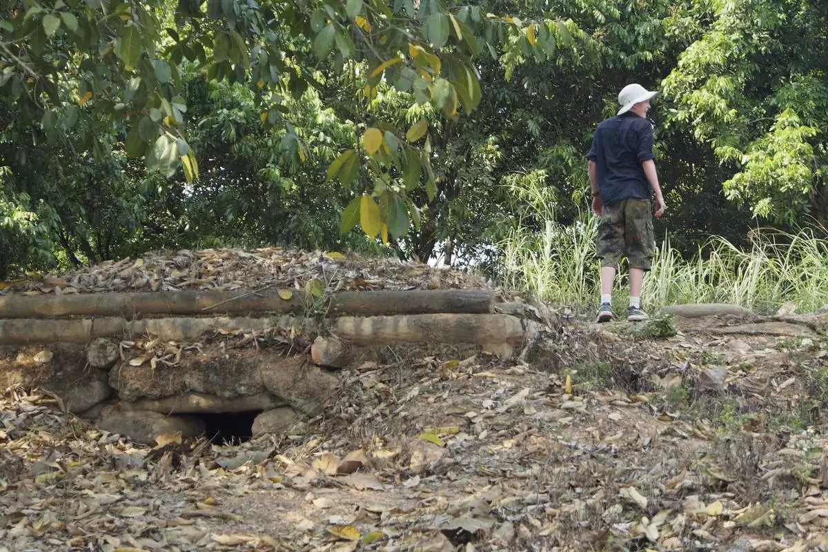A tourist looks over old French fortifications in Dien Bien Phu, Vietnam, April 22, 2019. (AP Photo/David Rising)