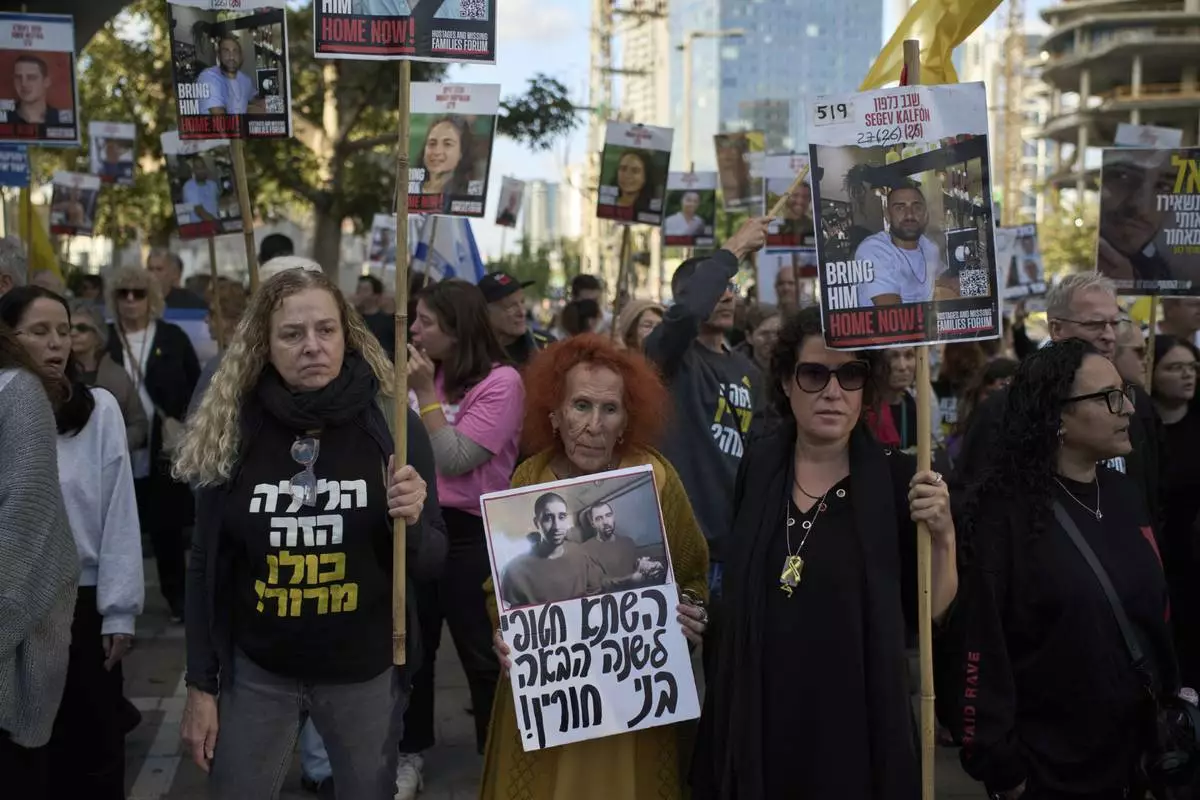 People gather in a protest demanding the immediate release of hostages held by Hamas in the Gaza Strip, during the Jewish holiday of Passover, in Tel Aviv, Israel, Saturday, April 12, 2025. (AP Photo/Leo Correa)