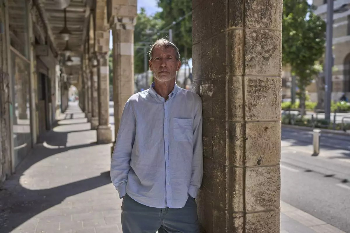 Guy Poran, a former pilot who is one of the initiators of a list of air force personnel calling for the army to focus on releasing the hostages, poses for a portrait in Tel Aviv, Wednesday, April 16, 2025. (AP Photo/Ohad Zwigenberg)