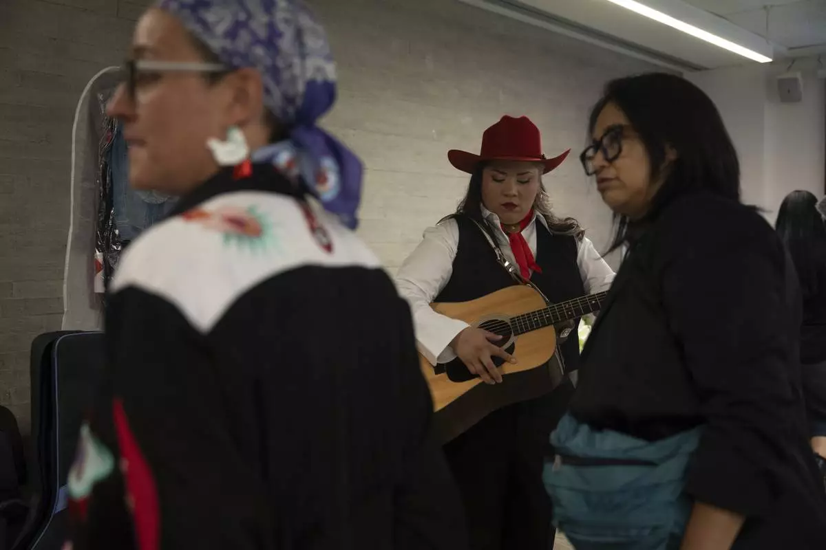 Mexican corridos singer Vivir Quintana prepares to perform her new album, about violence against women, in Mexico City, Thursday, April 24, 2025. (AP Photo/Aurea Del Rosario)