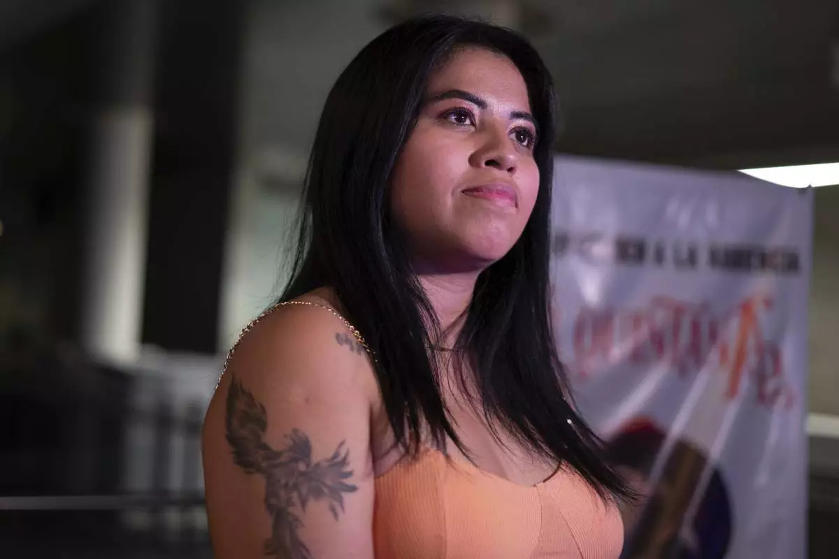 Yakiri Rubio attends a performance of Mexican corridos singer Vivir Quintana in Mexico City, Thursday, April 24, 2025. (AP Photo/Aurea Del Rosario)