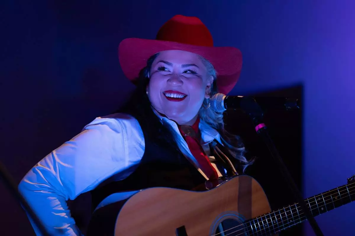 Mexican corridos singer Vivir Quintana performs her new album, about violence against women, in Mexico City, Thursday, April 24, 2025. (AP Photo/Aurea Del Rosario)