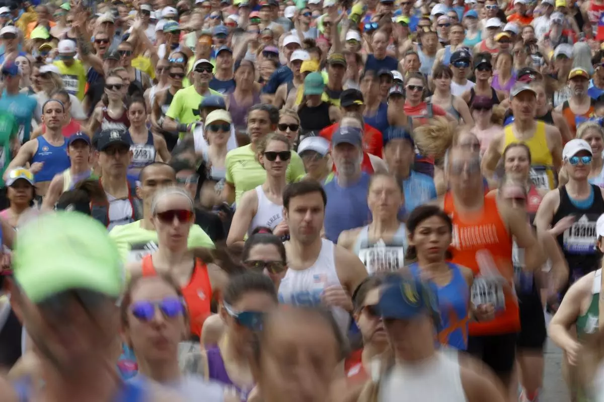 FILE - A wave a runners set out from the start of the Boston Marathon, April 15, 2024, in Hopkinton, Mass. (AP Photo/Mary Schwalm, File)