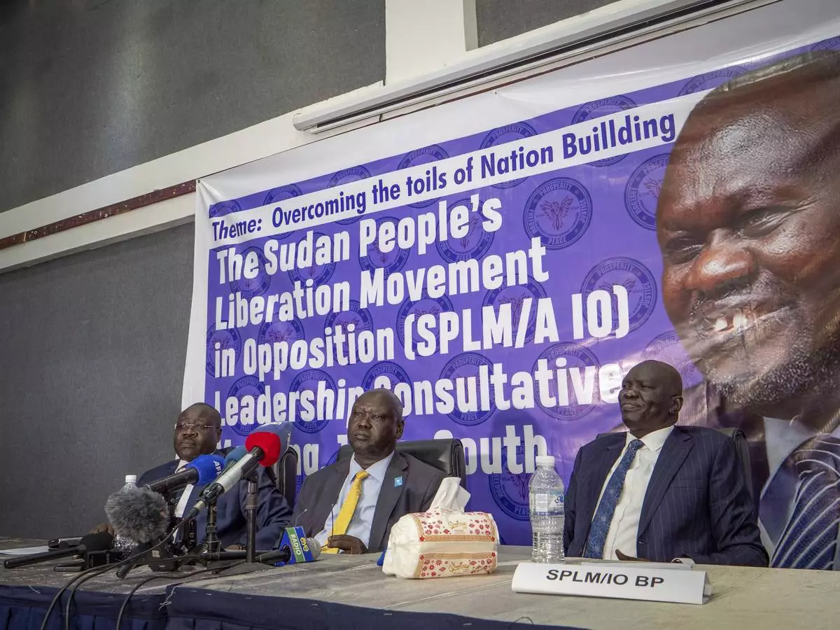 South Sudan's minister of Peace building, Stephen Par Kuol, centre, addresses the media after being declared interim chairman of the Sudan People's Liberation Movement-In Opposition (SPLM-IO), in Juba, South Sudan Wednesday, April 9, 2025. (AP Photo/Florence Miettaux)
