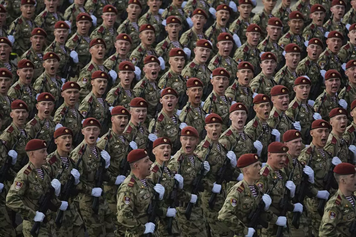 Russian servicemen march towards the Red Square prior to the Victory Day military parade general rehearsal in Moscow, Russia, Wednesday, May 7, 2025. (AP Photo/Pavel Bednyakov)