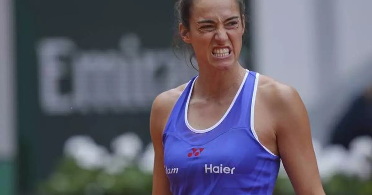 A teary-eyed Caroline Garcia plays her final French Open match
