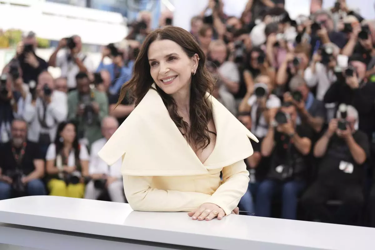 Jury member Juliette Binoche poses for photographers at the jury photo call at the 78th international film festival, Cannes, southern France, Tuesday, May 13, 2025. (AP Photo/Natacha Pisarenko)