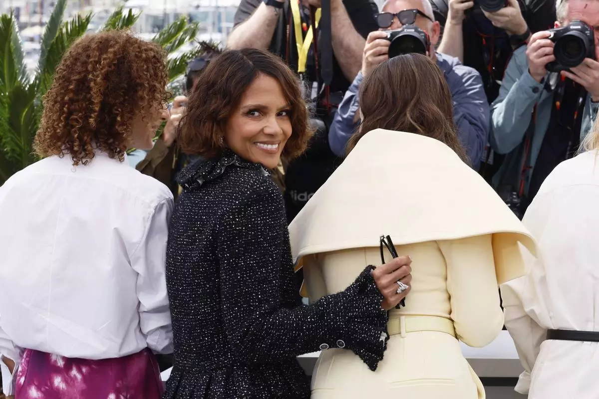 Jury members Leila Slimani, left, and Halle Berry, pose with jury president Juliette Binoche at the jury photo call at the 78th international film festival, Cannes, southern France, Tuesday, May 13, 2025. (Photo by Joel C Ryan/Invision/AP)