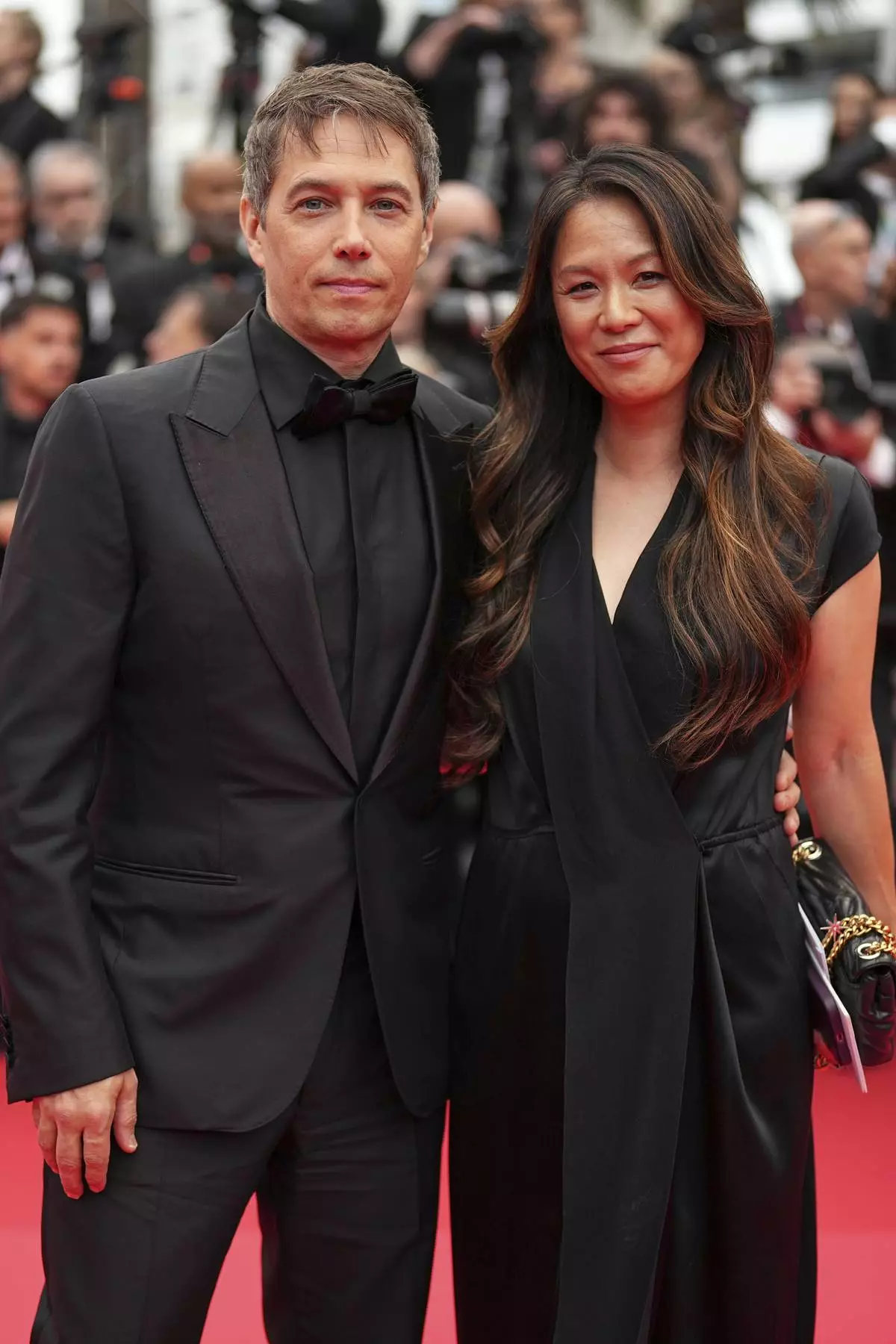 Sean Baker, left, and Samantha Quan pose for photographers during the opening ceremony red carpet of the 78th international film festival, Cannes, southern France, Tuesday, May 13, 2025. (Photo by Scott A Garfitt/Invision/AP)