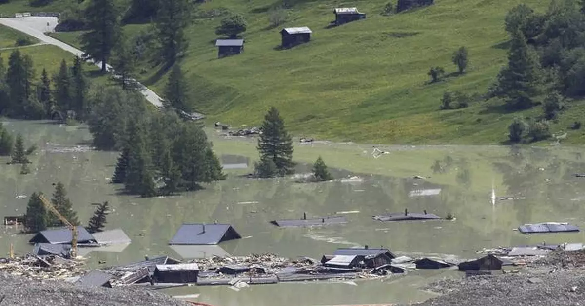 A river dammed by a huge Swiss landslide is flowing again. That's a relief to authorities